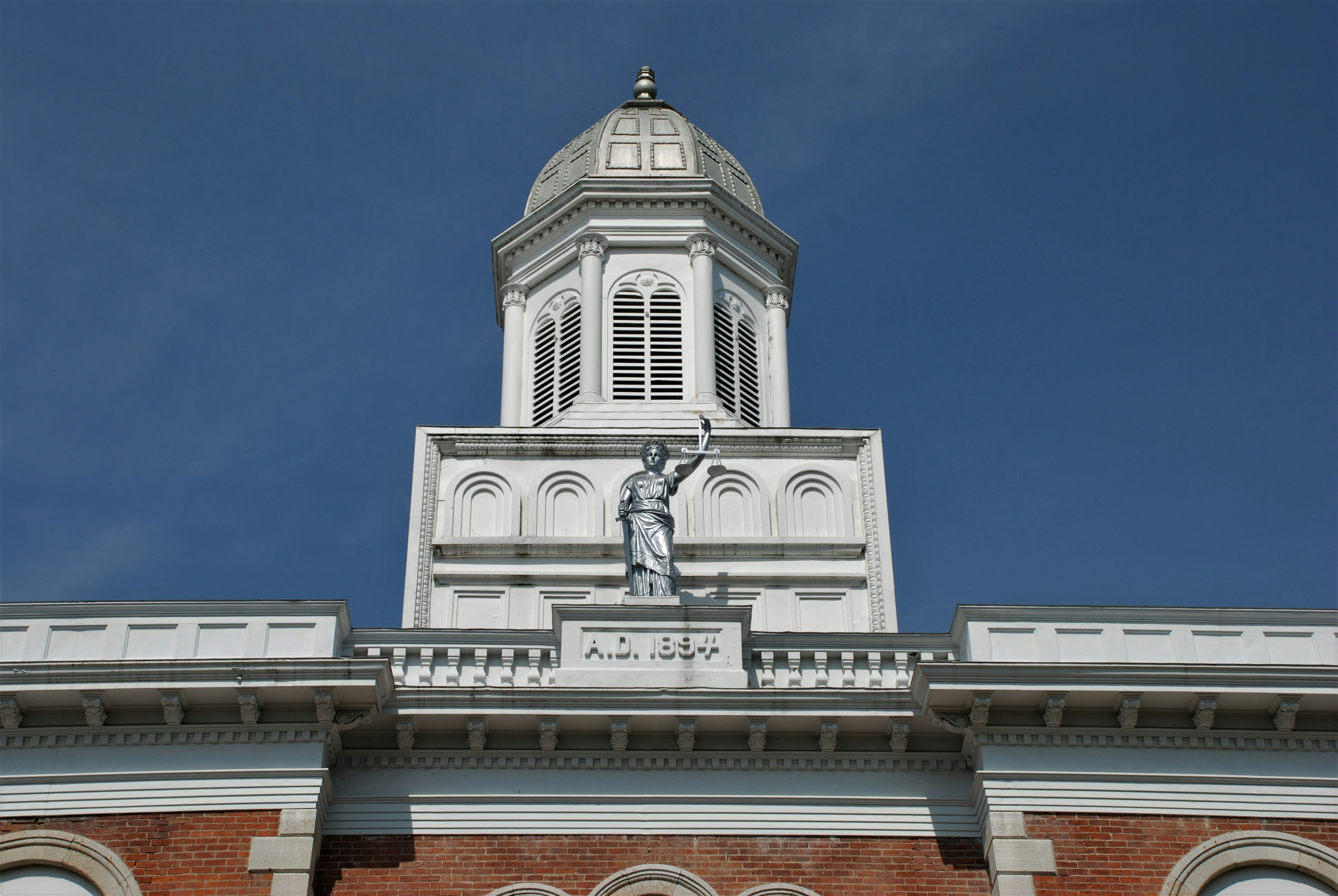 Old court house tower and statue