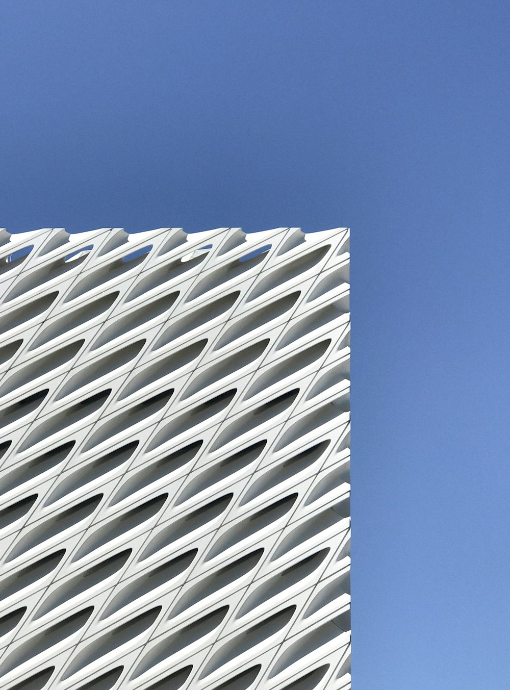 white concrete building under blue sky during daytime