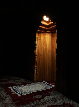 Beautifully designed Islamic prayer mats displayed in a serene setting.