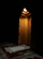 A serene prayer corner featuring a Harmain Prayer mat and softly glowing lantern.