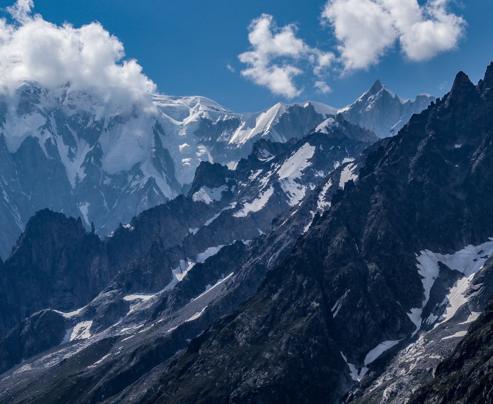 snow covered mountain under blue sky during daytime