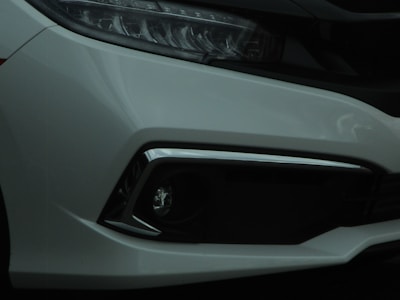 Close-up of the compact car's front grille and headlights.