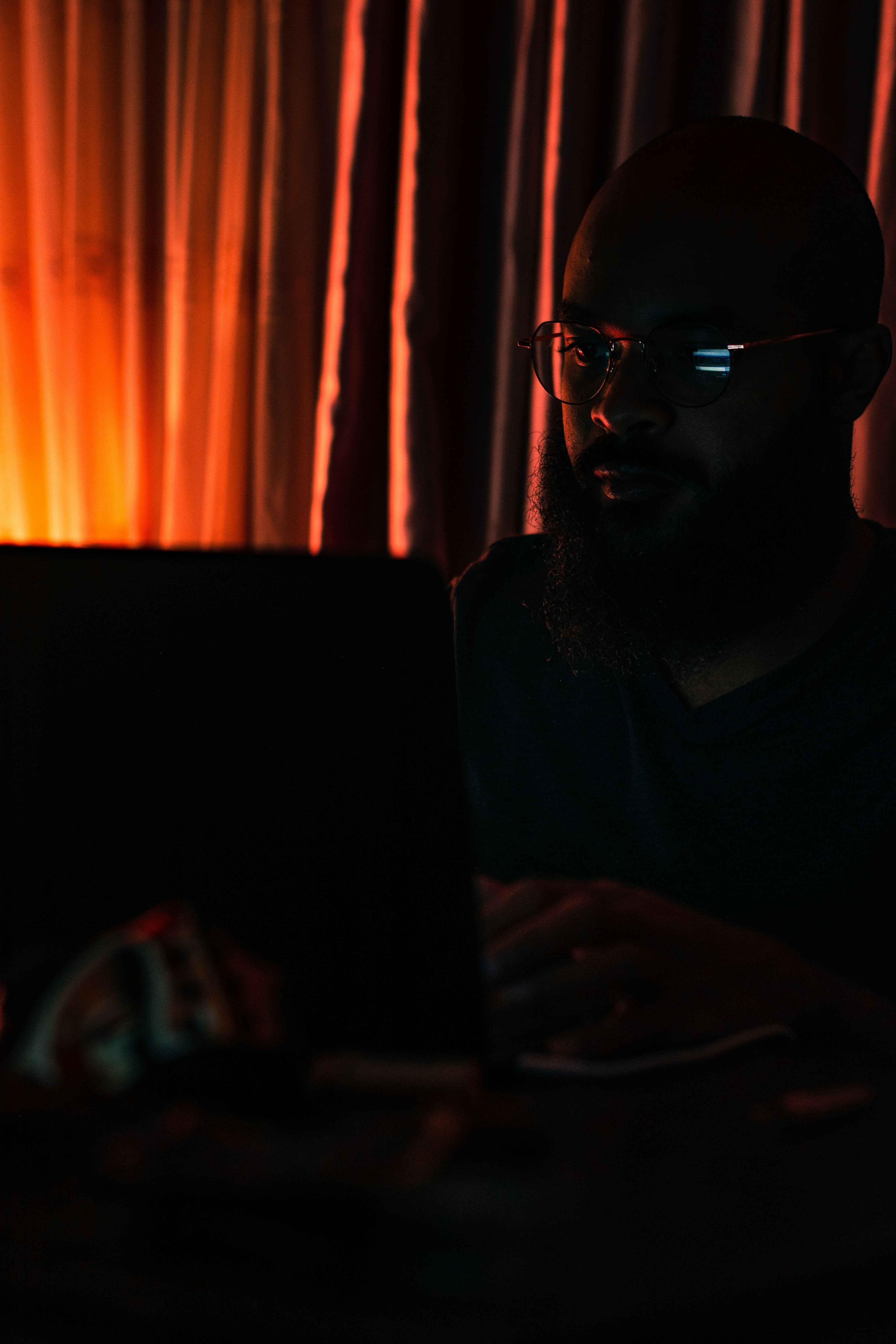 man in black crew neck shirt wearing black framed eyeglasses