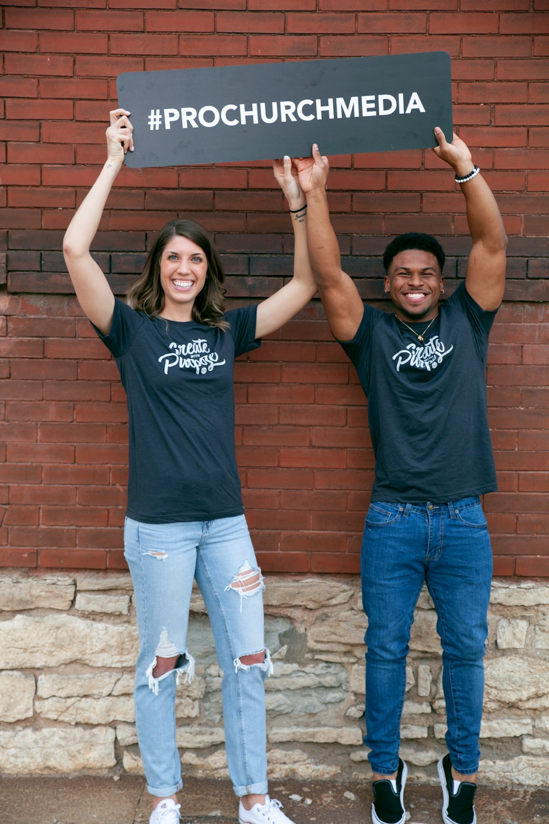 man in black crew neck t-shirt standing beside woman in black crew neck t-shirt