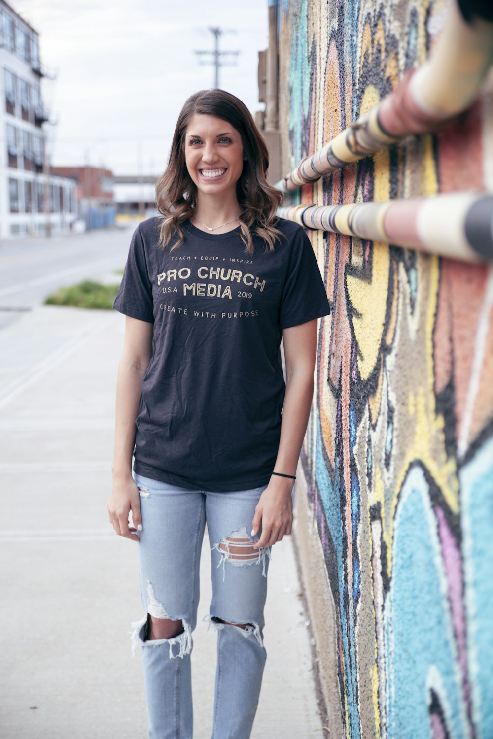 Woman In Black Crew Neck T-Shirt And Blue Denim Jeans Standing Beside Wall  With Graffiti Photo â€“ Free Clothing Image On Unsplash