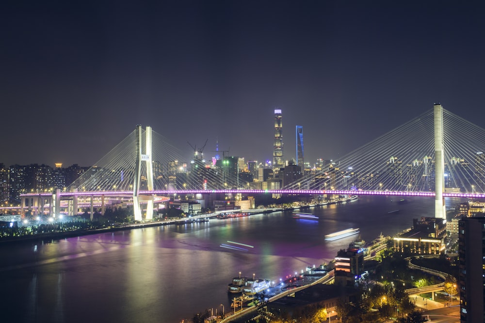 bridge over river during night time