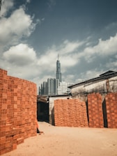 brown concrete building under cloudy sky during daytime