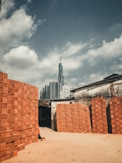 brown concrete building under cloudy sky during daytime