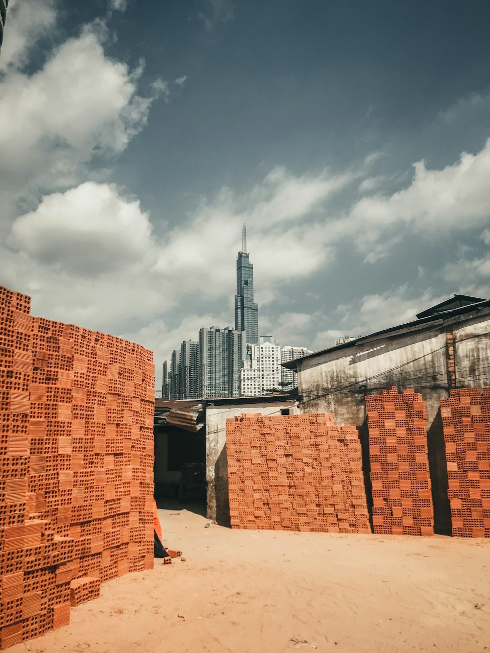 brown concrete building under cloudy sky during daytime