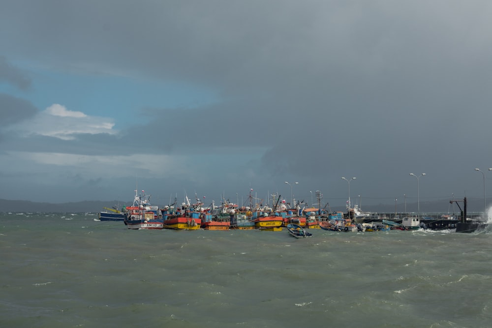 boat on sea under gray sky