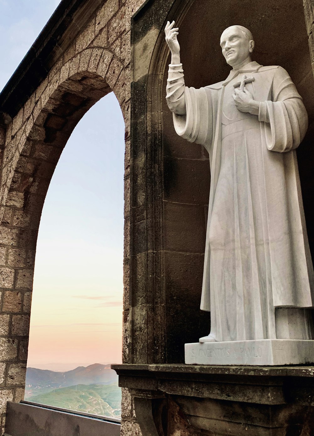 man in white robe statue