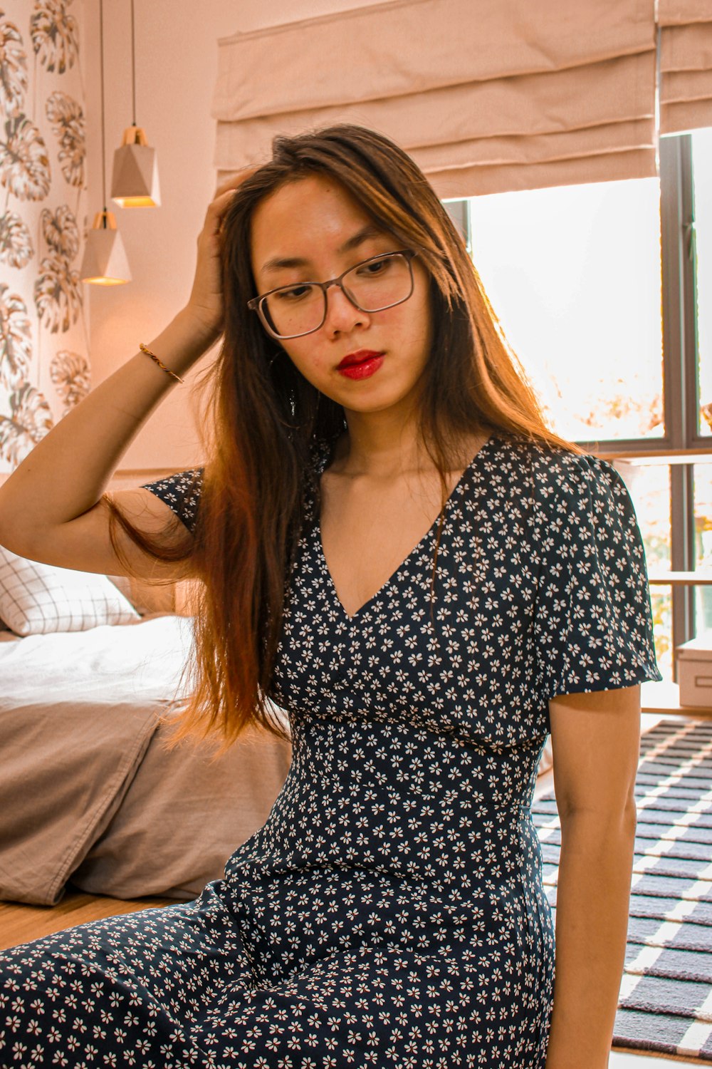 woman in black and white polka dot sleeveless dress