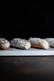 brown bread with white icing on white ceramic plate