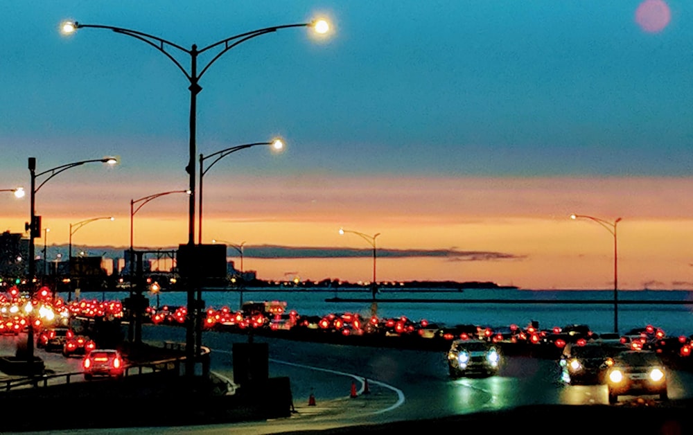 cars on road during sunset