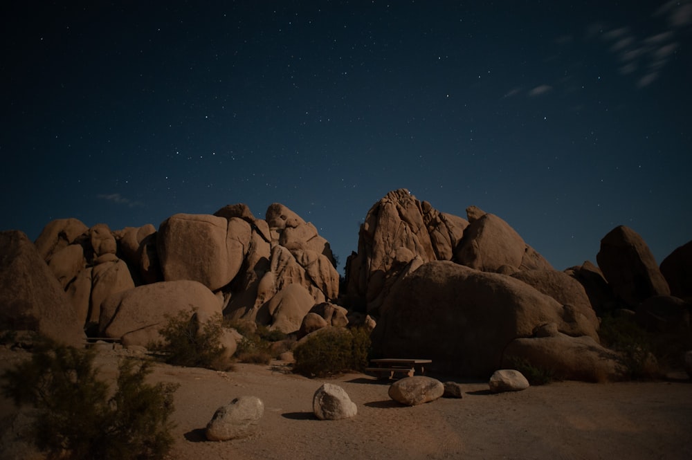 brown rock formation under blue sky during night time