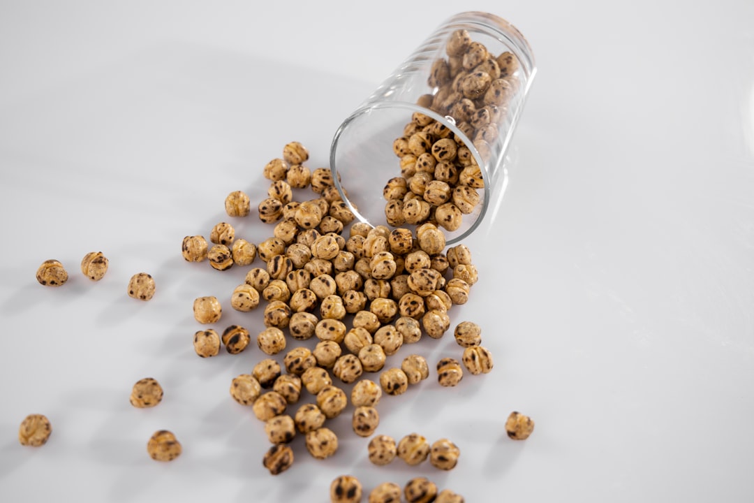 brown coffee beans in clear glass jar