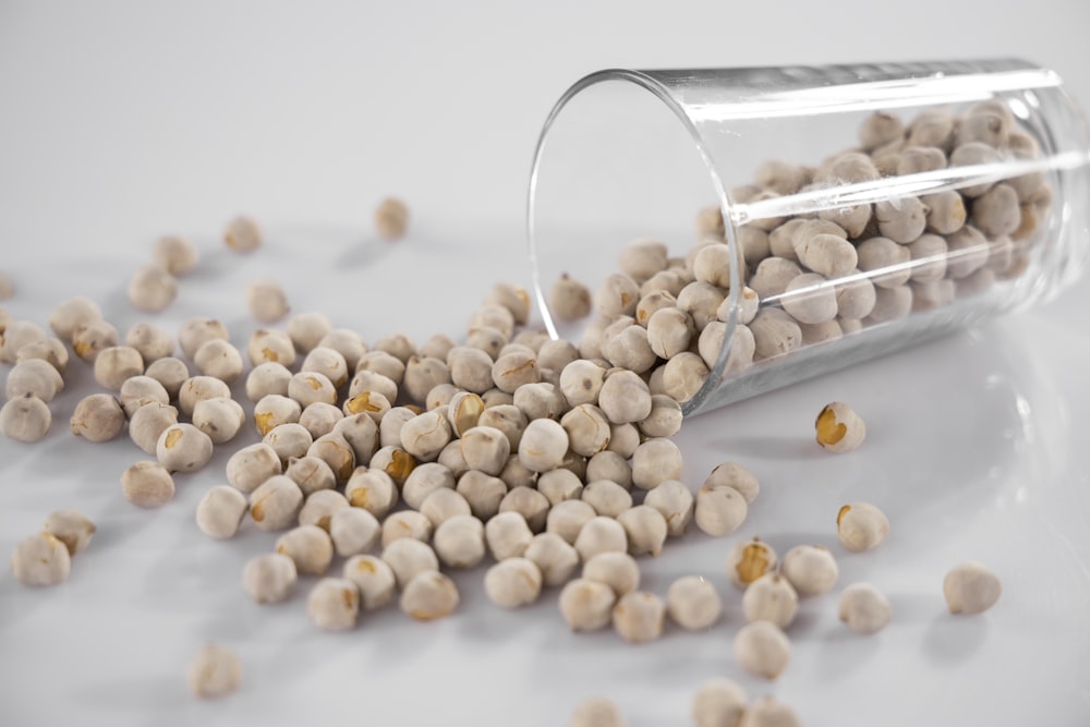 white and brown beans on silver steel rack