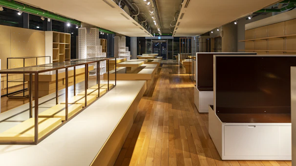 A serene, minimalist wellness store interior with natural light and clean wooden shelves displaying supplements.