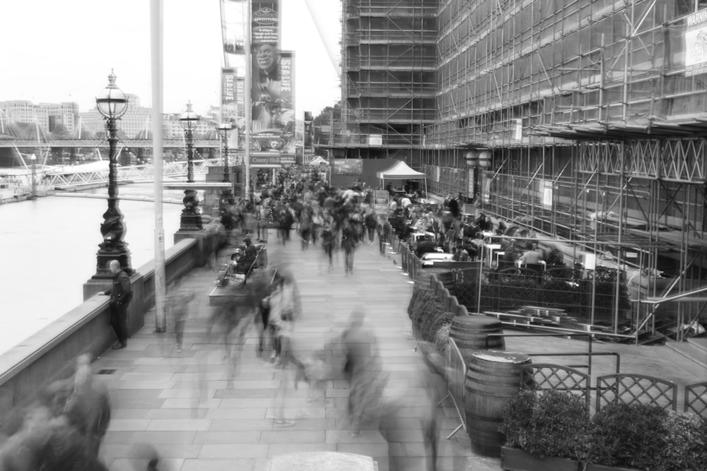 grayscale photo of people walking on street