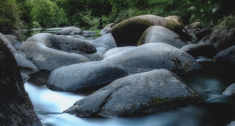 gray rocks on river during daytime