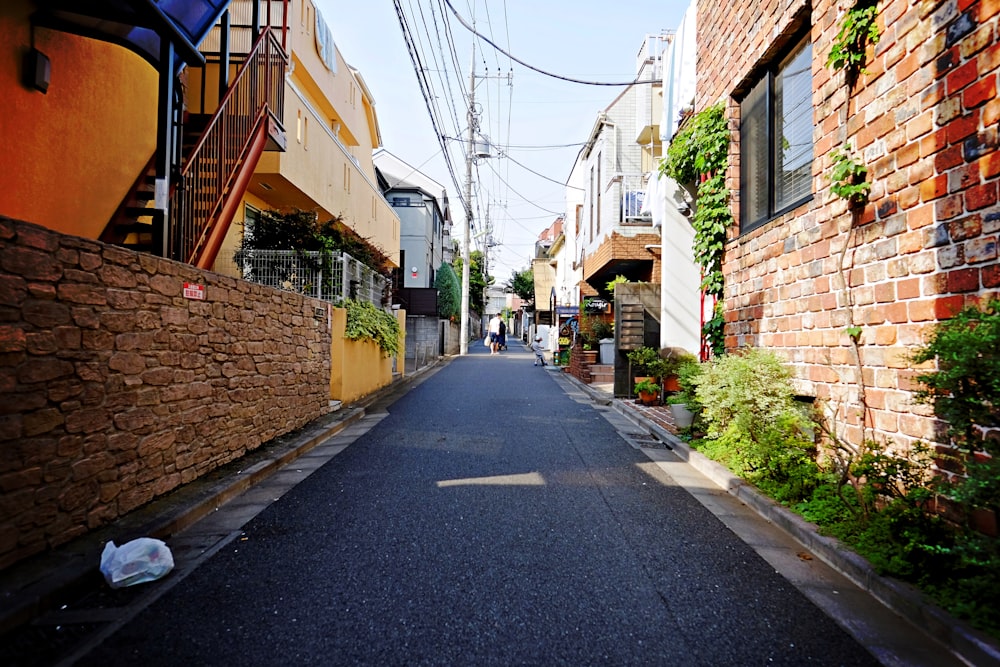 empty road between brick houses