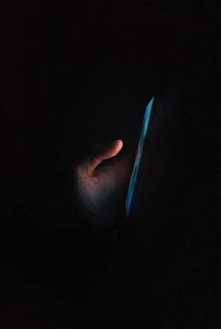 A comforting night-time digital chat interface glowing softly on a smartphone screen.