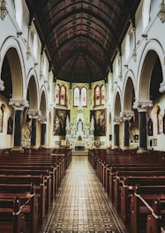 brown wooden chairs inside cathedral