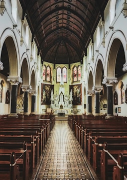 brown wooden chairs inside cathedral