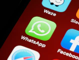 smartphone screen showing icons with logo guessing game