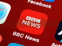 the bbc news logo is displayed on a computer screen