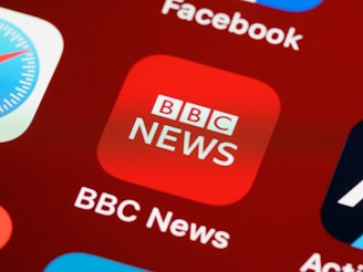 the bbc news logo is displayed on a computer screen