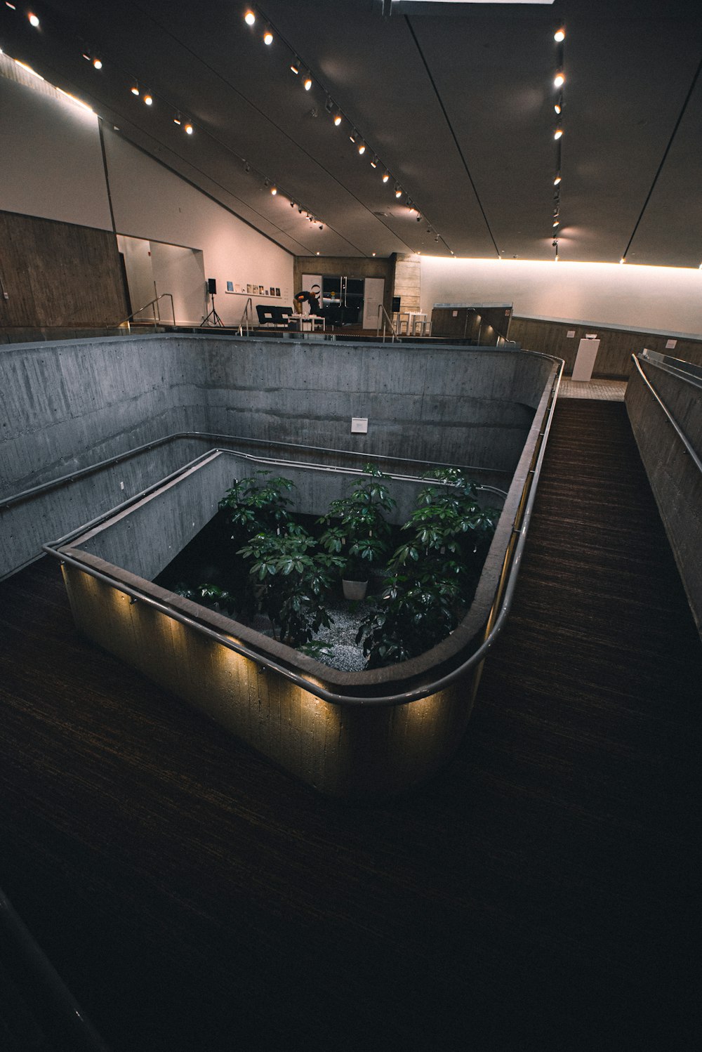 a planter in the middle of a large room