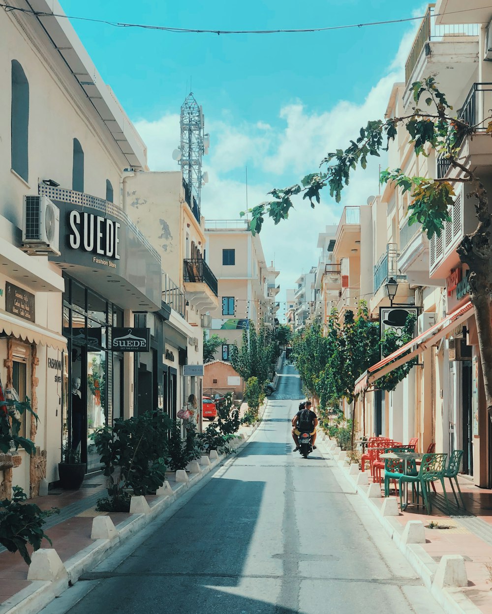 people walking on street between buildings during daytime