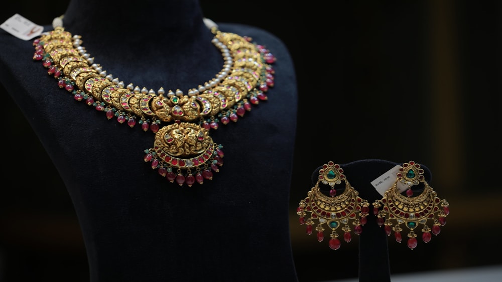 gold and red beaded necklace