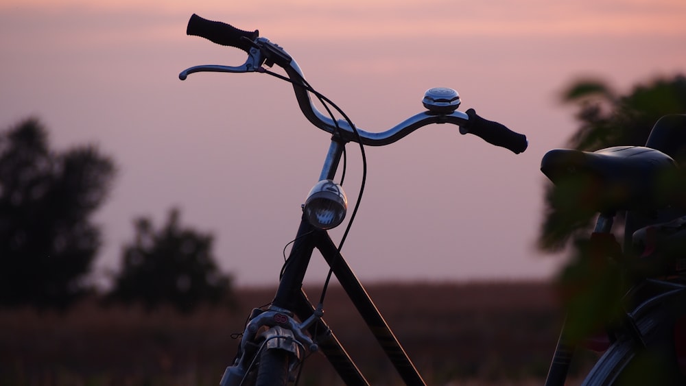 black bicycle with black and gray bicycle handle bar