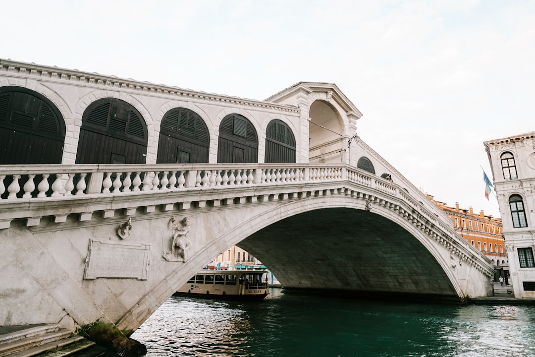 white concrete bridge over river during daytime