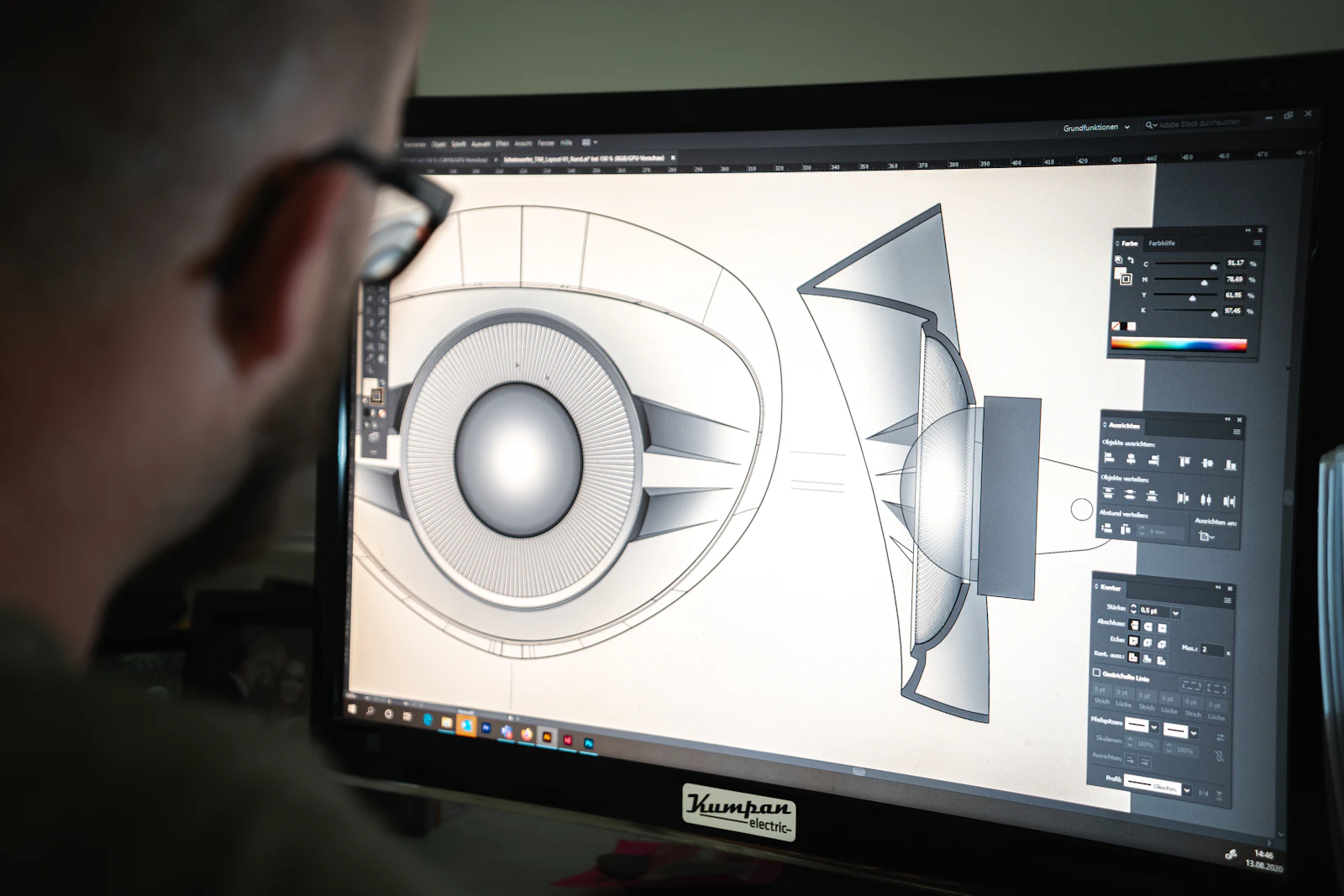 A 3D CAD model of a mechanical part on a designer's monitor