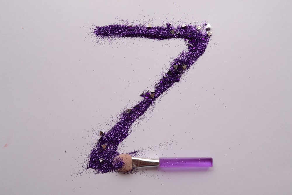 purple and white stick with white background