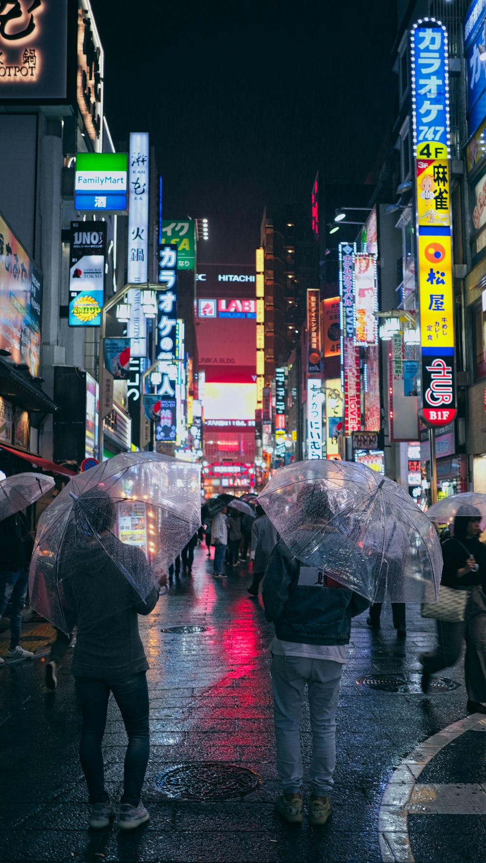 people walking on street during night time