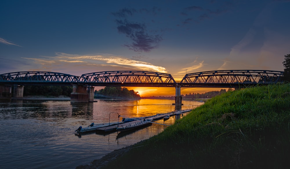 brown wooden bridge over river during night time