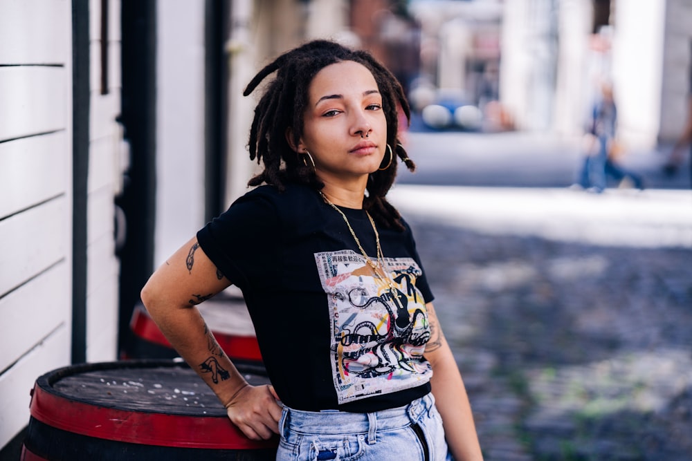 woman in black crew neck t-shirt and blue denim shorts