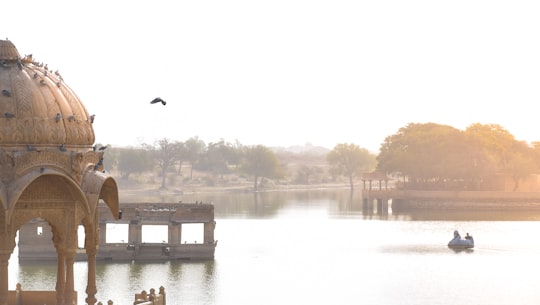 body of water near bridge during daytime in Jaisalmer India