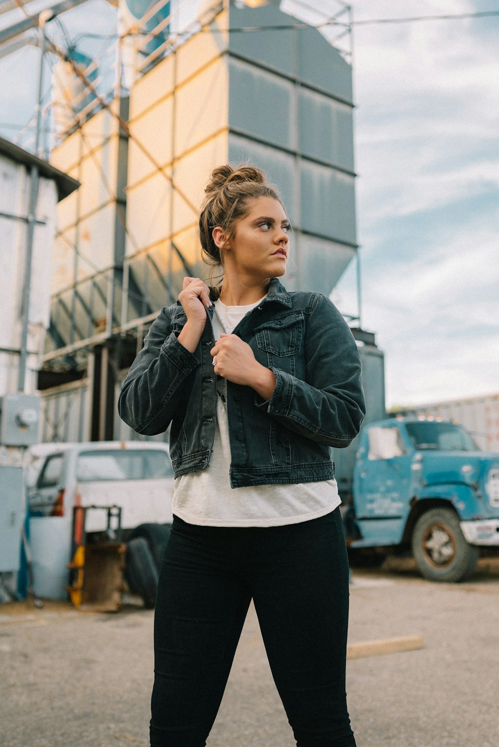 woman in black jacket holding smartphone