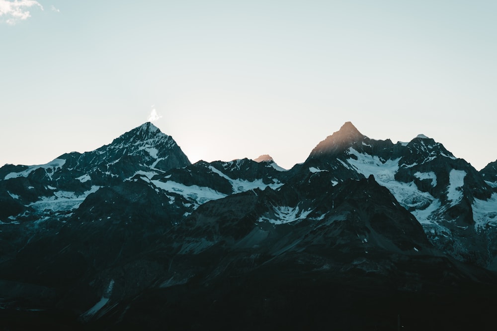 snow covered mountain during daytime