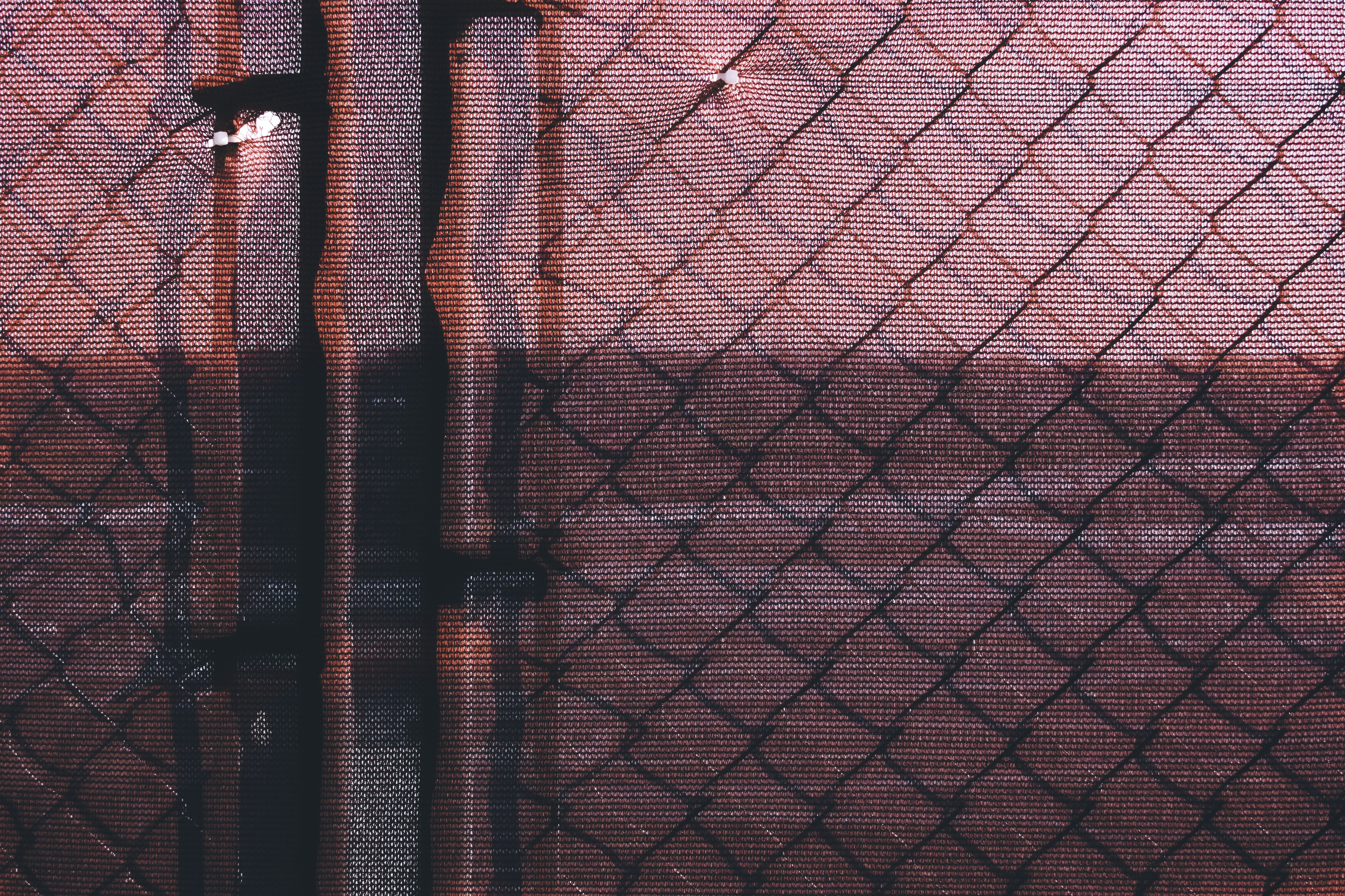 brown metal chain link fence