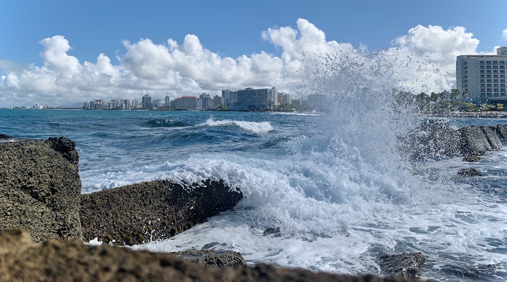 ocean waves crashing on shore during daytime