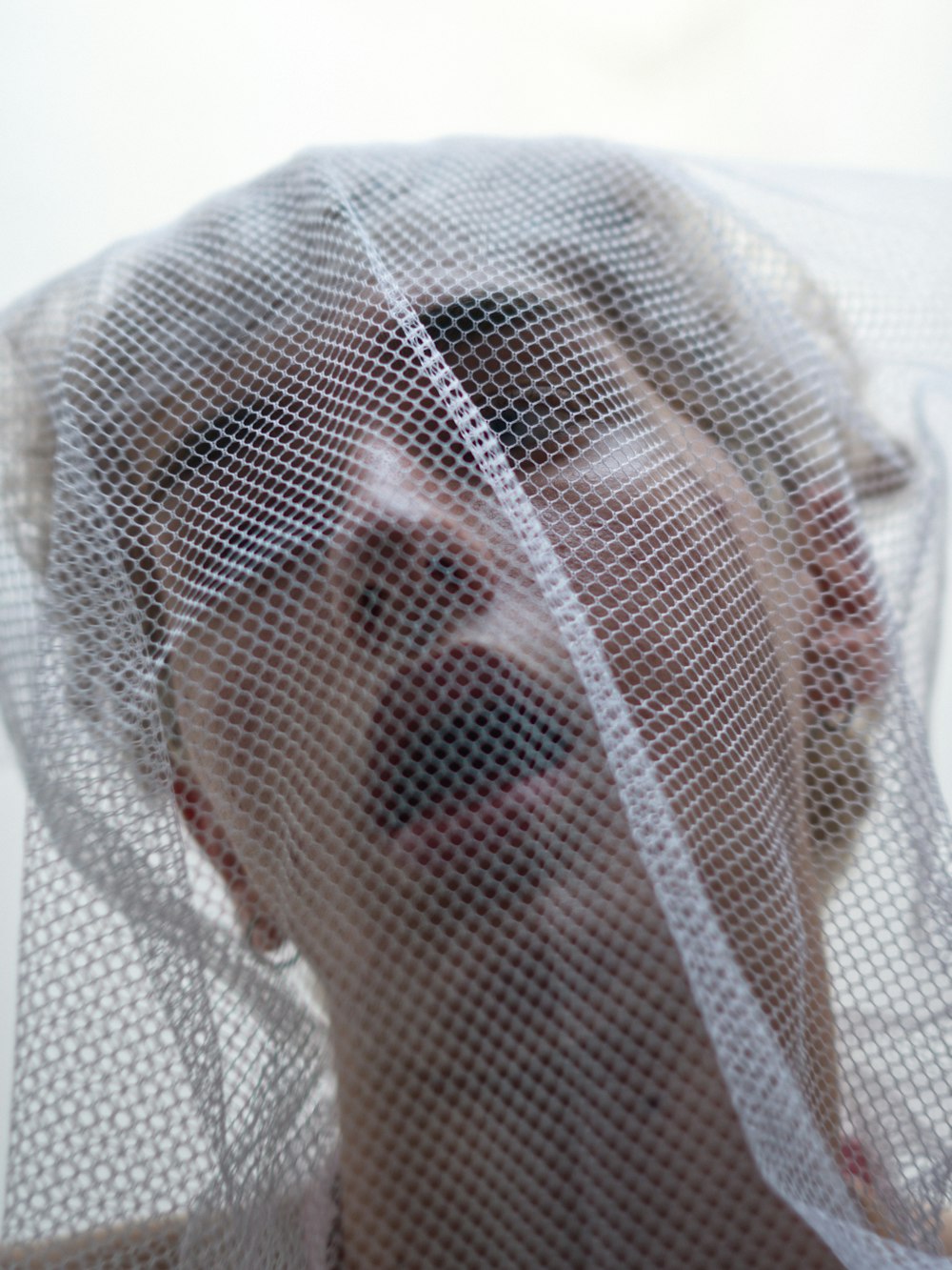 woman in white mesh veil