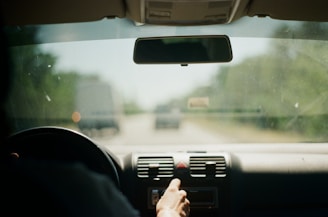 person driving car during daytime