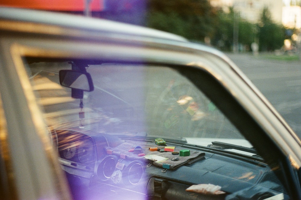 black car side mirror with purple light