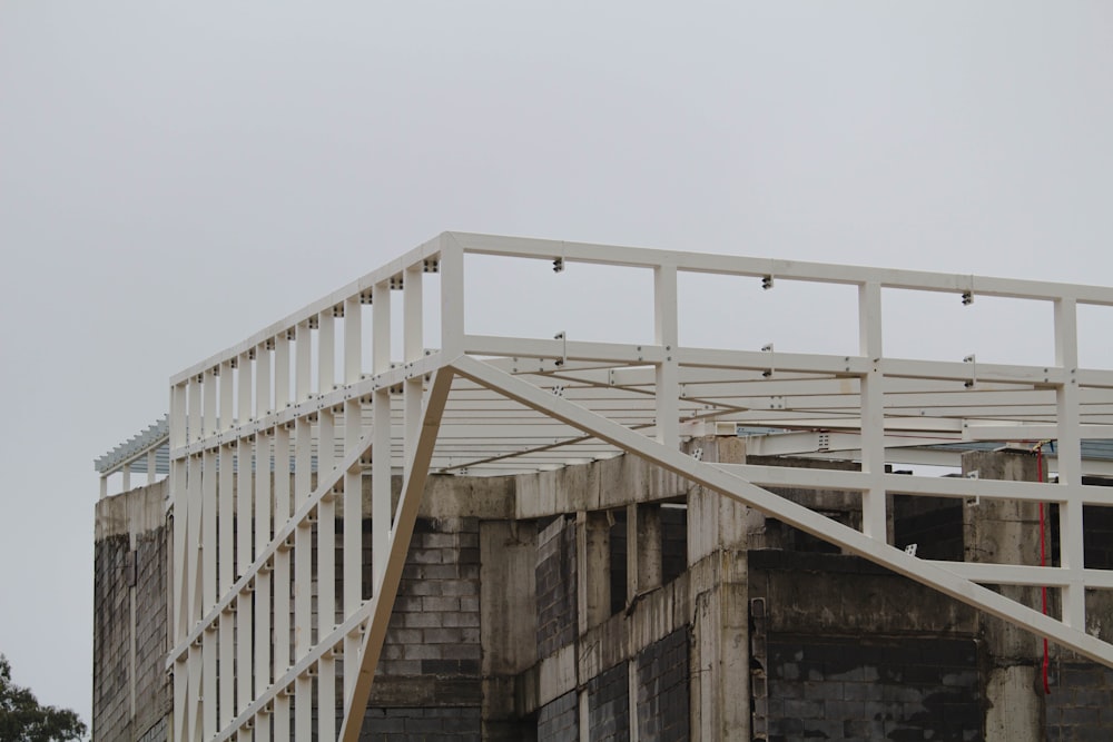 white wooden staircase under white sky during daytime
